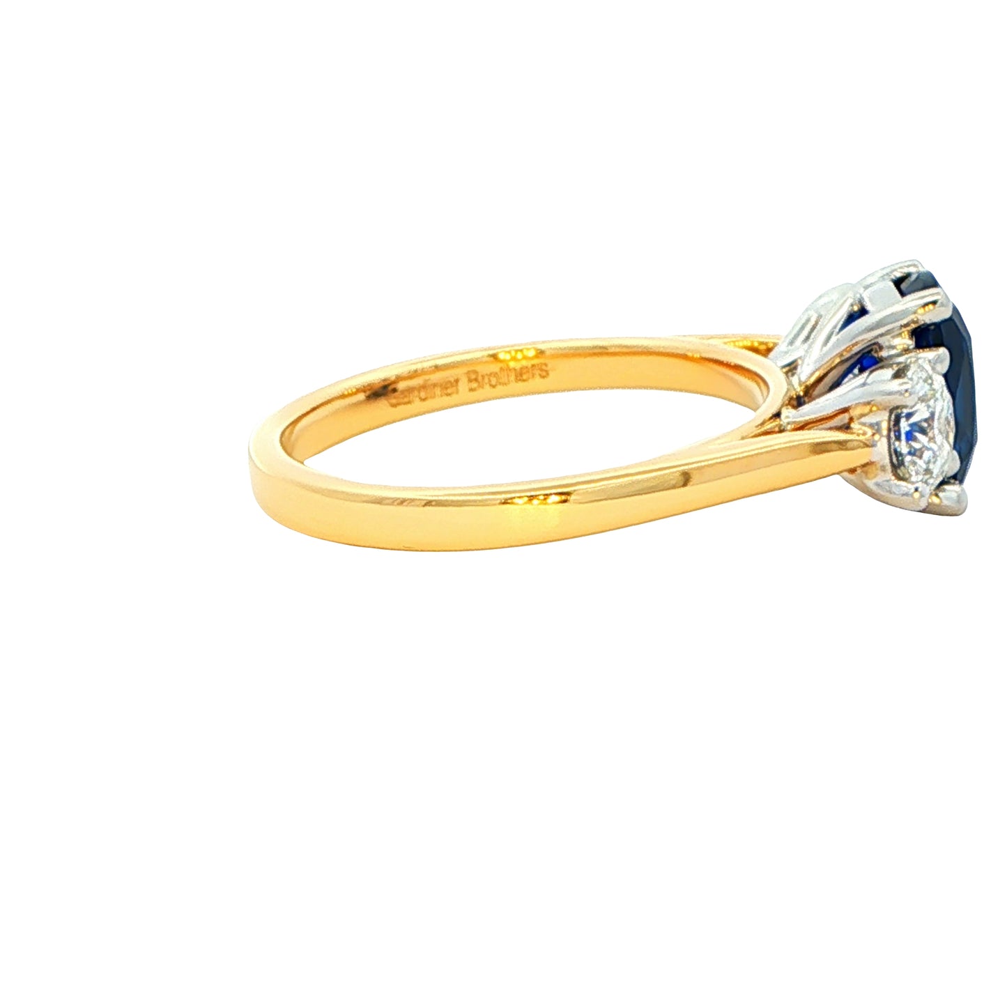 Cushion Sapphire and round brilliant cut diamond 3 stone ring Gardiner Brothers