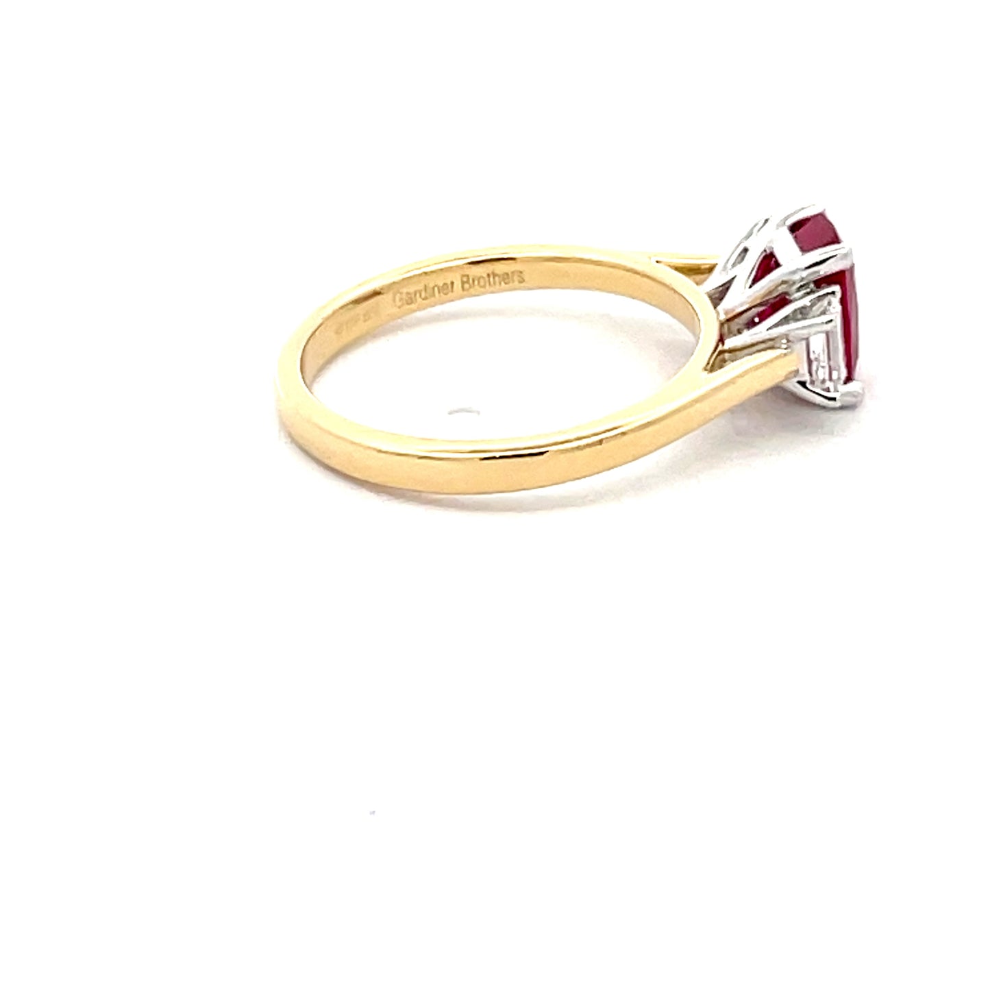 Octagonal Ruby and emerald cut diamond 3 stone ring Gardiner Brothers