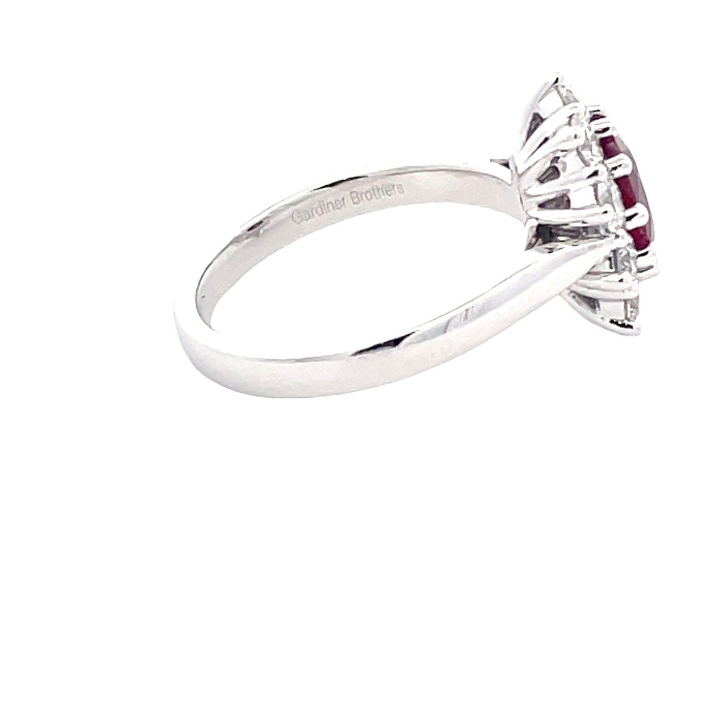 Oval Shaped Ruby and Round Brilliant Cut Diamond Cluster Style Ring Gardiner Brothers