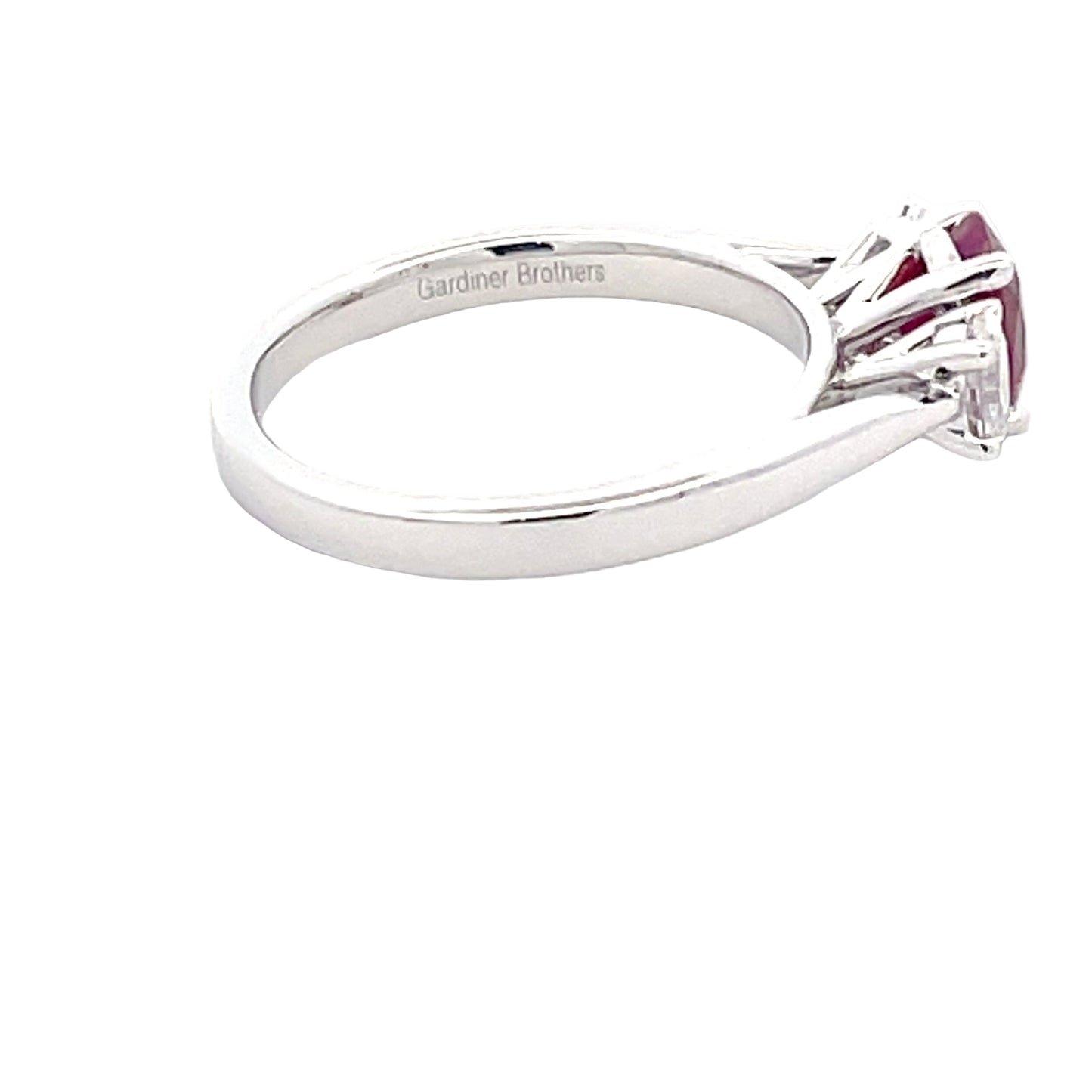 Oval Shaped ruby and round brilliant cut diamond 3 stone ring Gardiner Brothers