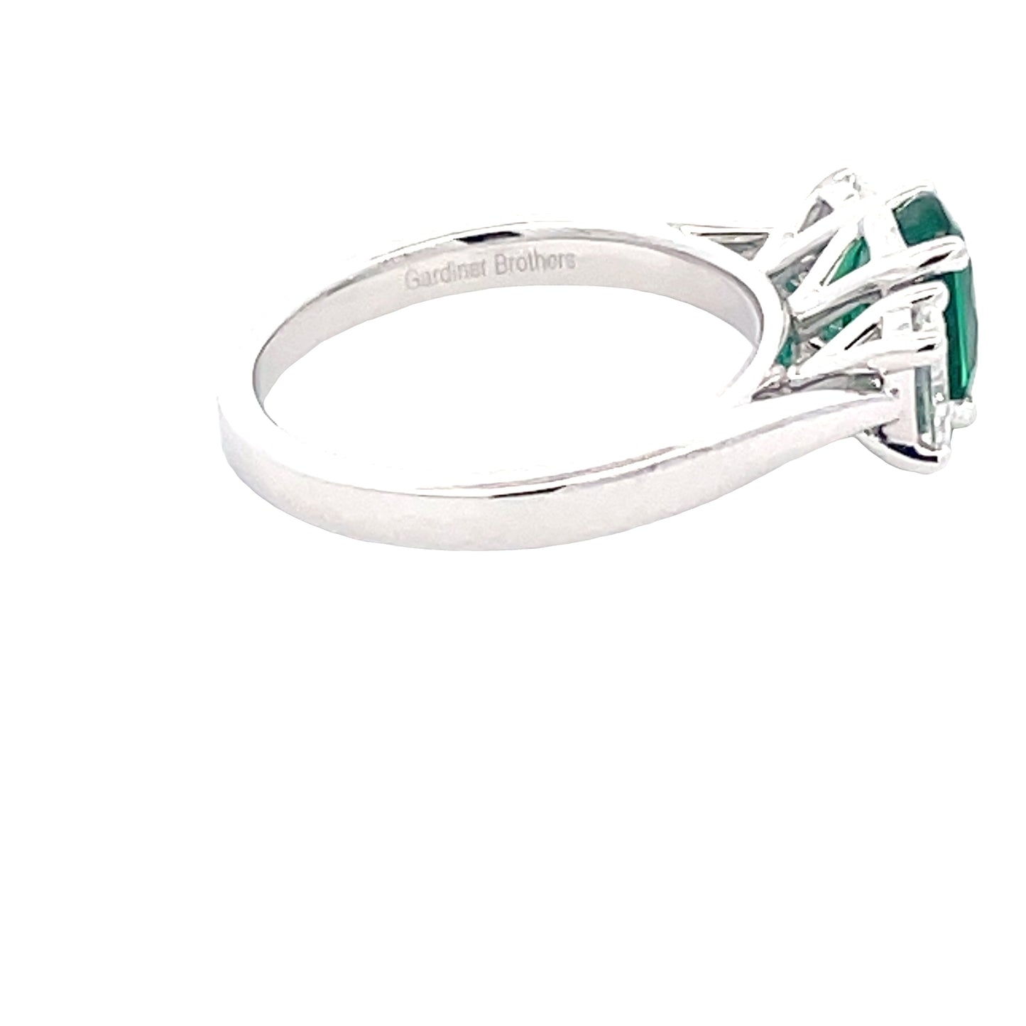 Oval Shaped emerald and oval diamond 3 stone ring Gardiner Brothers