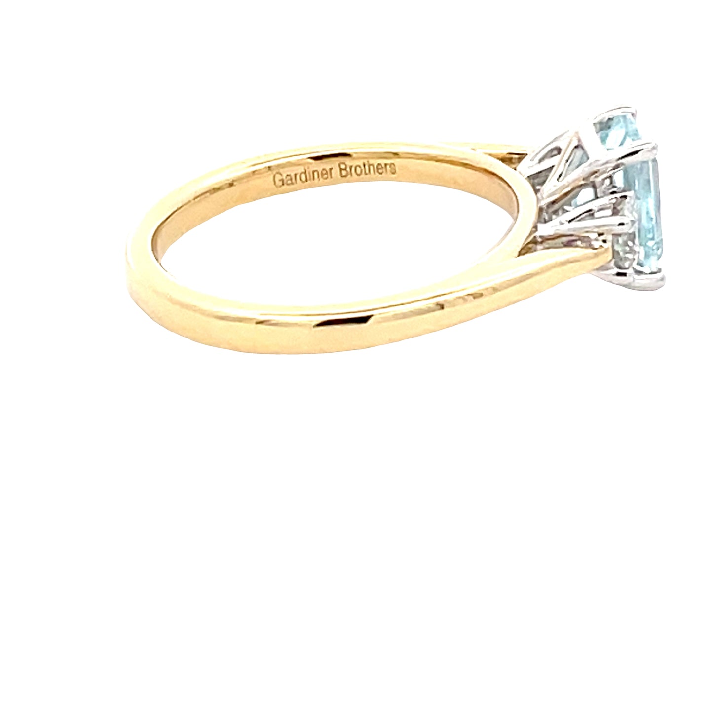 Octagonal Aquamarine and round brilliant cut diamond 3 stone ring Gardiner Brothers