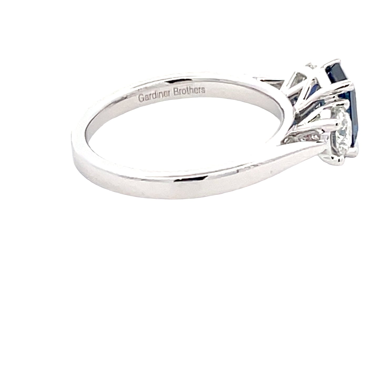 Octagonal Sapphire and round brilliant cut diamond 3 stone ring Gardiner Brothers