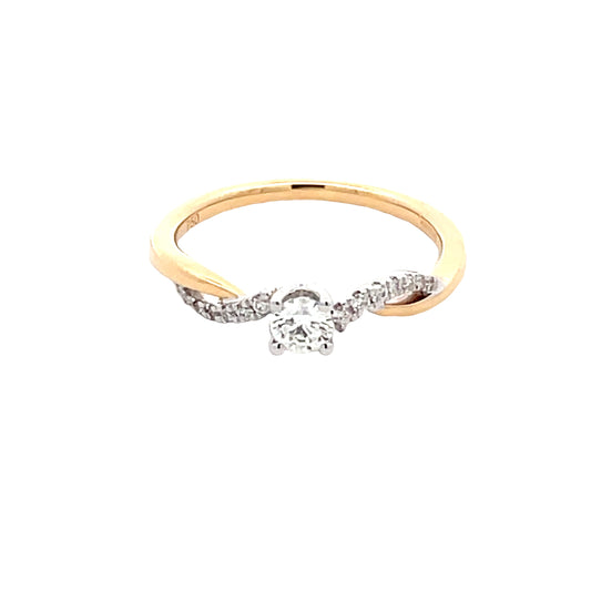 Round Brilliant Cut Diamond Solitaire Ring with cross-over diamond set shoulders