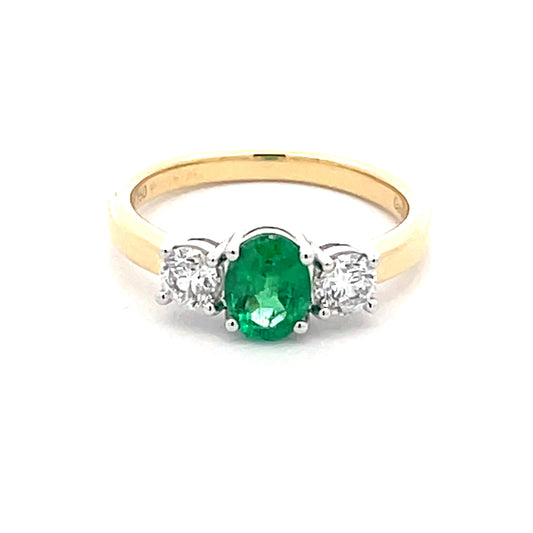 Oval Emerald and round brilliant cut diamond 3 stone ring