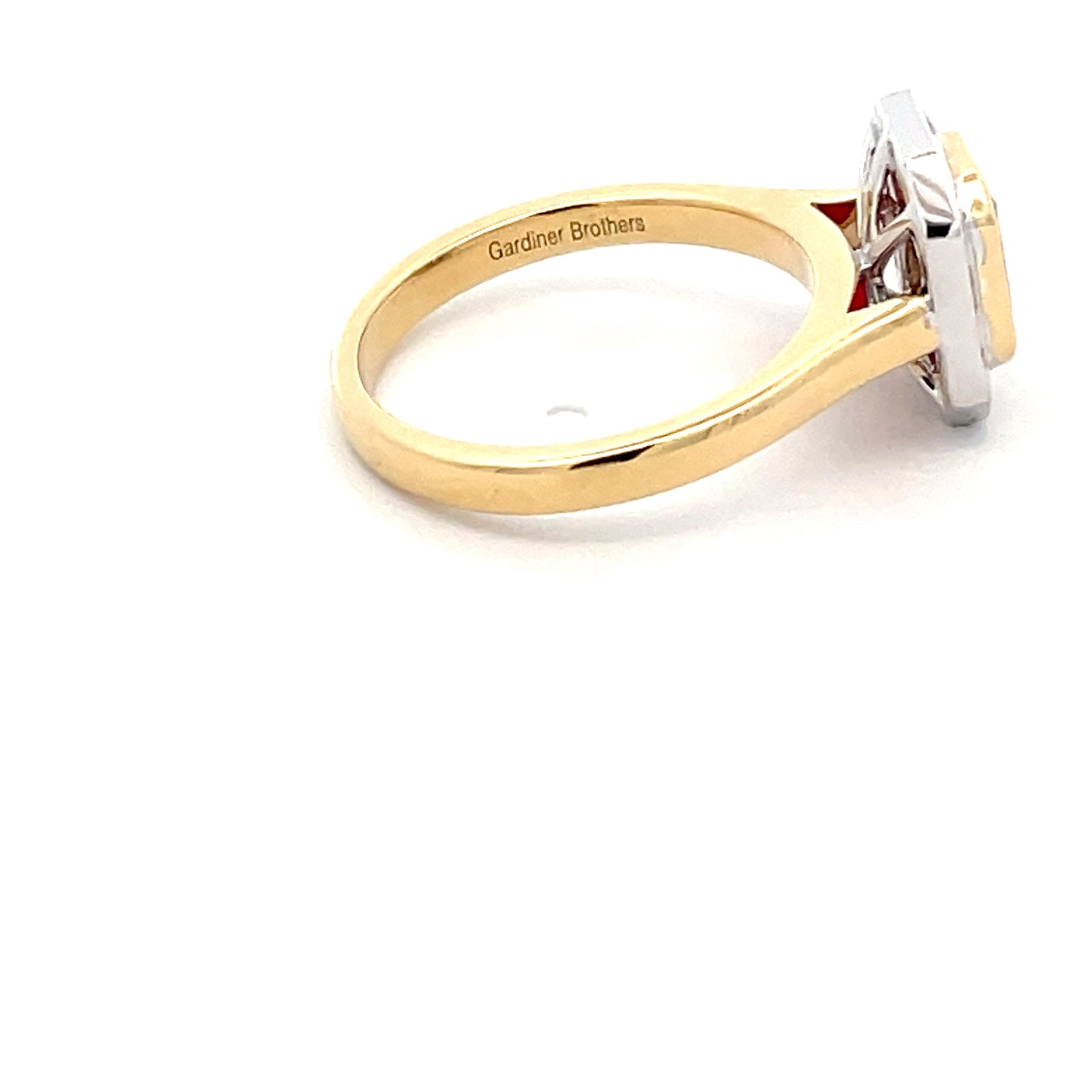 Octagonal Ruby with brilliant cut baguette cut diamond cluster ring Gardiner Brothers