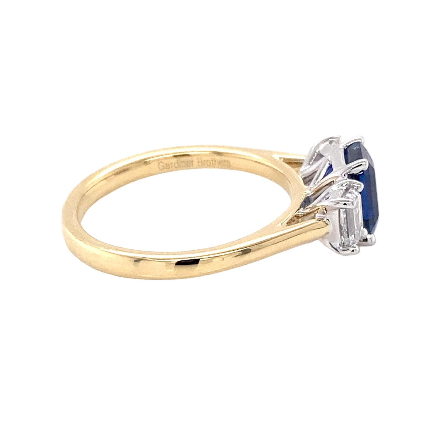 Octagonal shaped sapphire and emerald cut diamond 3 stone ring Gardiner Brothers