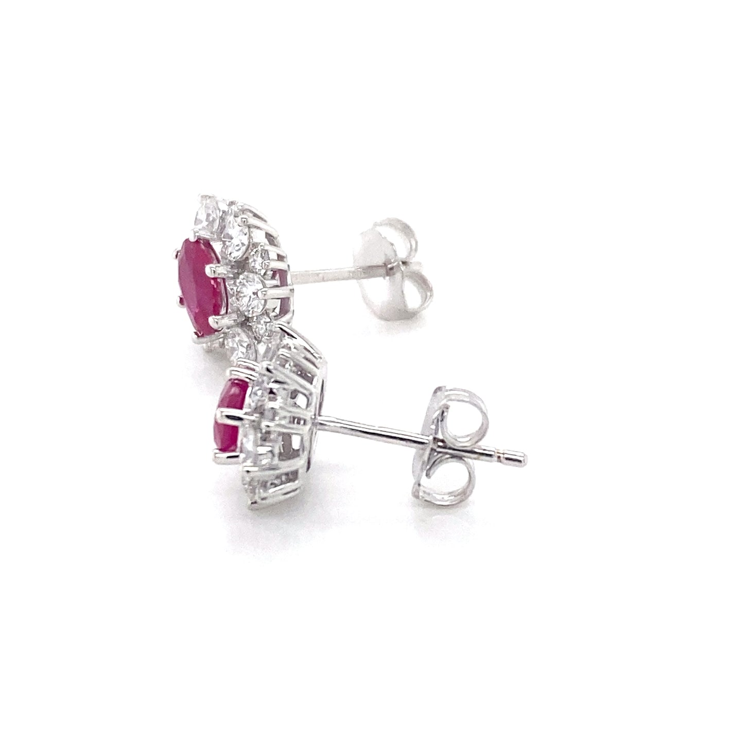Oval Shaped Ruby and round brilliant cut diamond cluster style earrings Gardiner Brothers