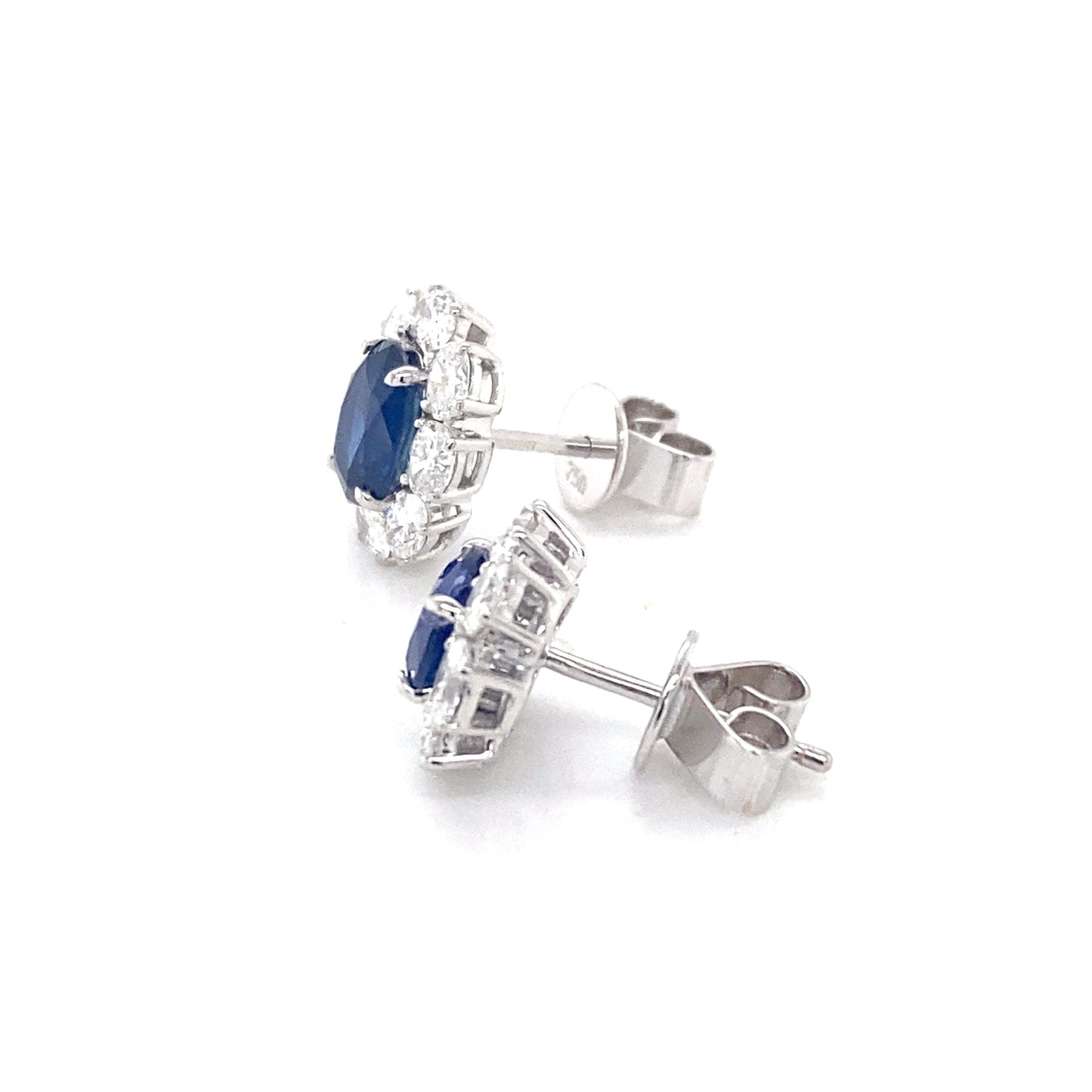 Oval Shaped Sapphire and oval shaped diamond cluster style earrings Gardiner Brothers