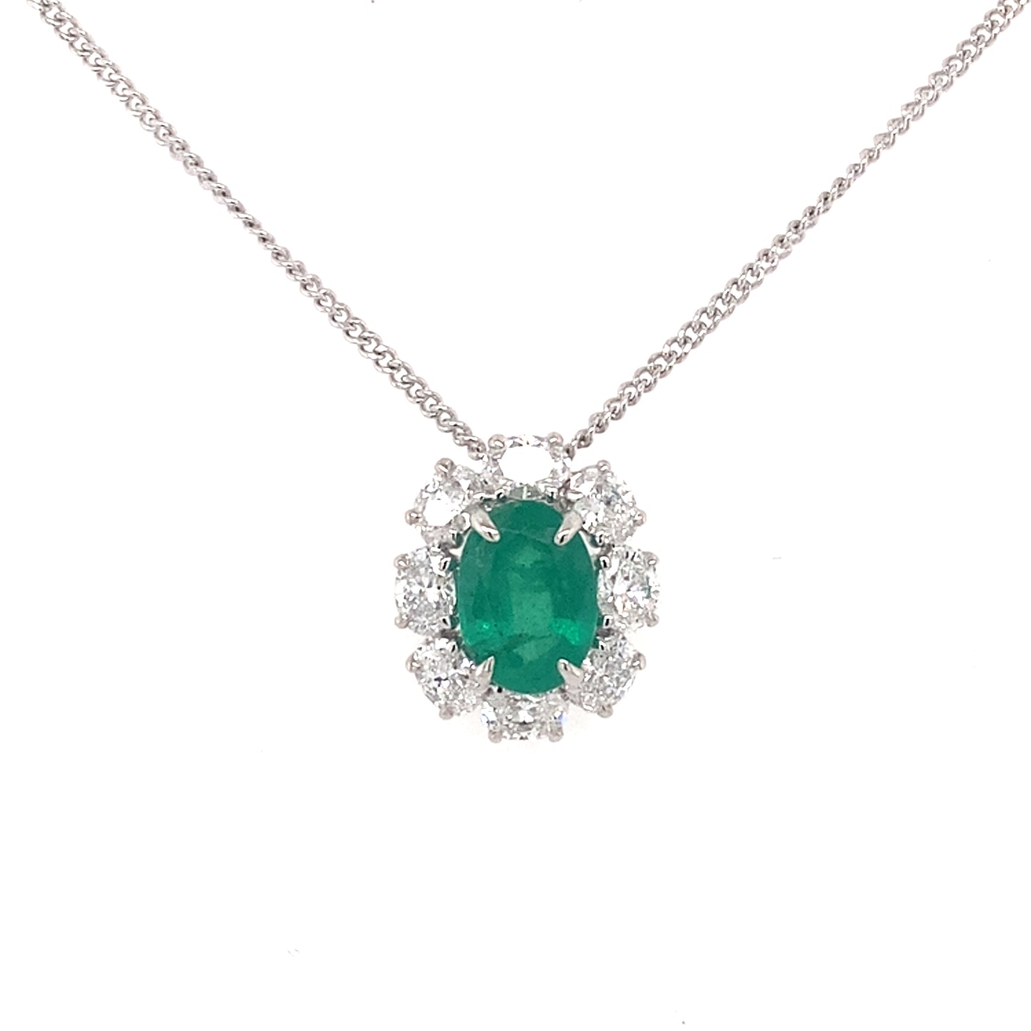 Oval shaped emerald and oval shaped diamond cluster style pendant Gardiner Brothers