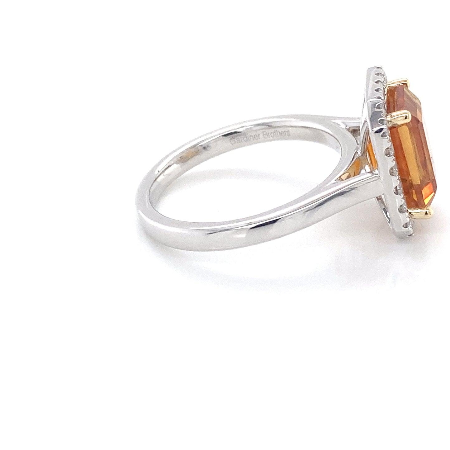 Octagonal Citrine and round brilliant cut diamond halo style ring Gardiner Brothers