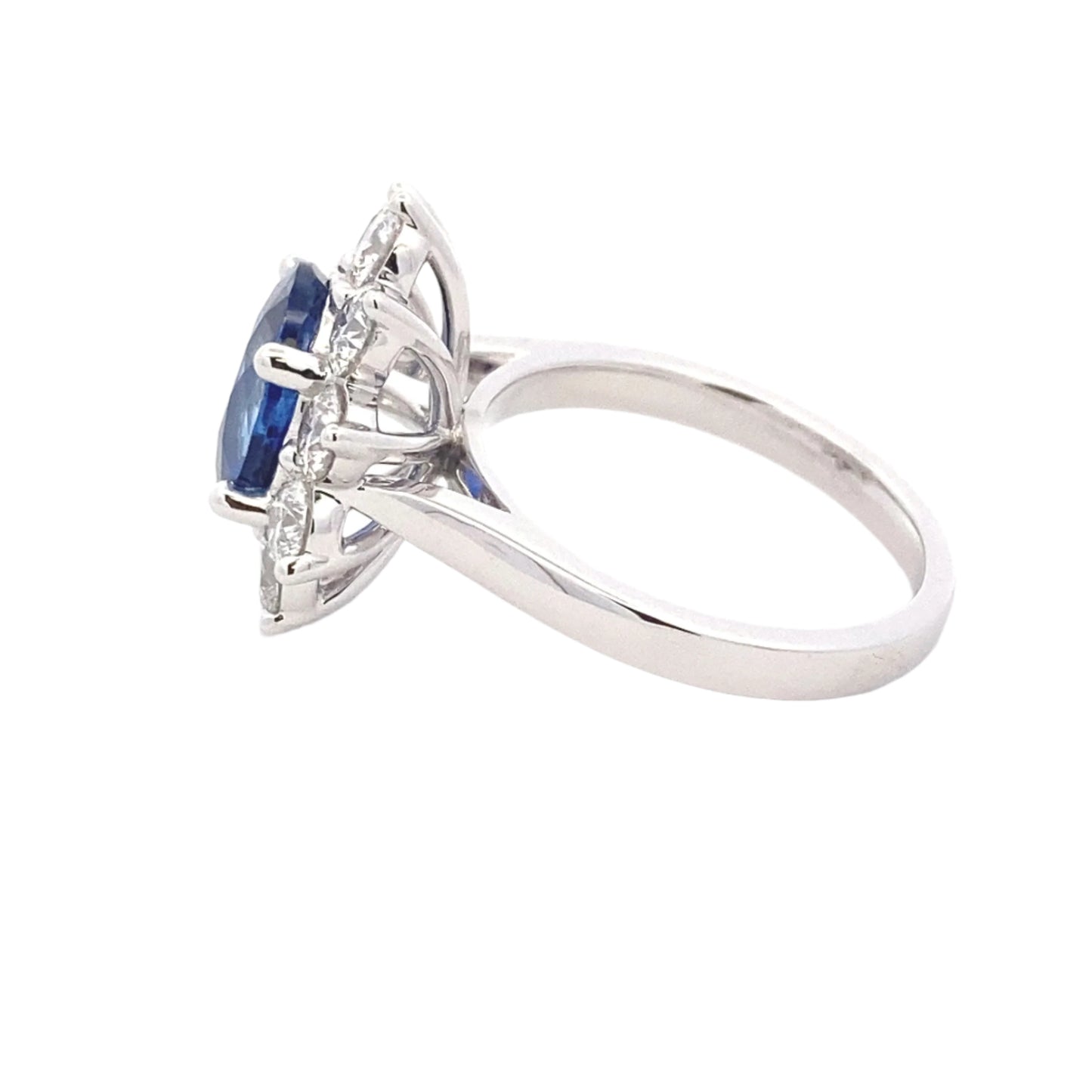 Oval Shaped Sapphire and round brilliant cut diamond traditional cluster ring Gardiner Brothers