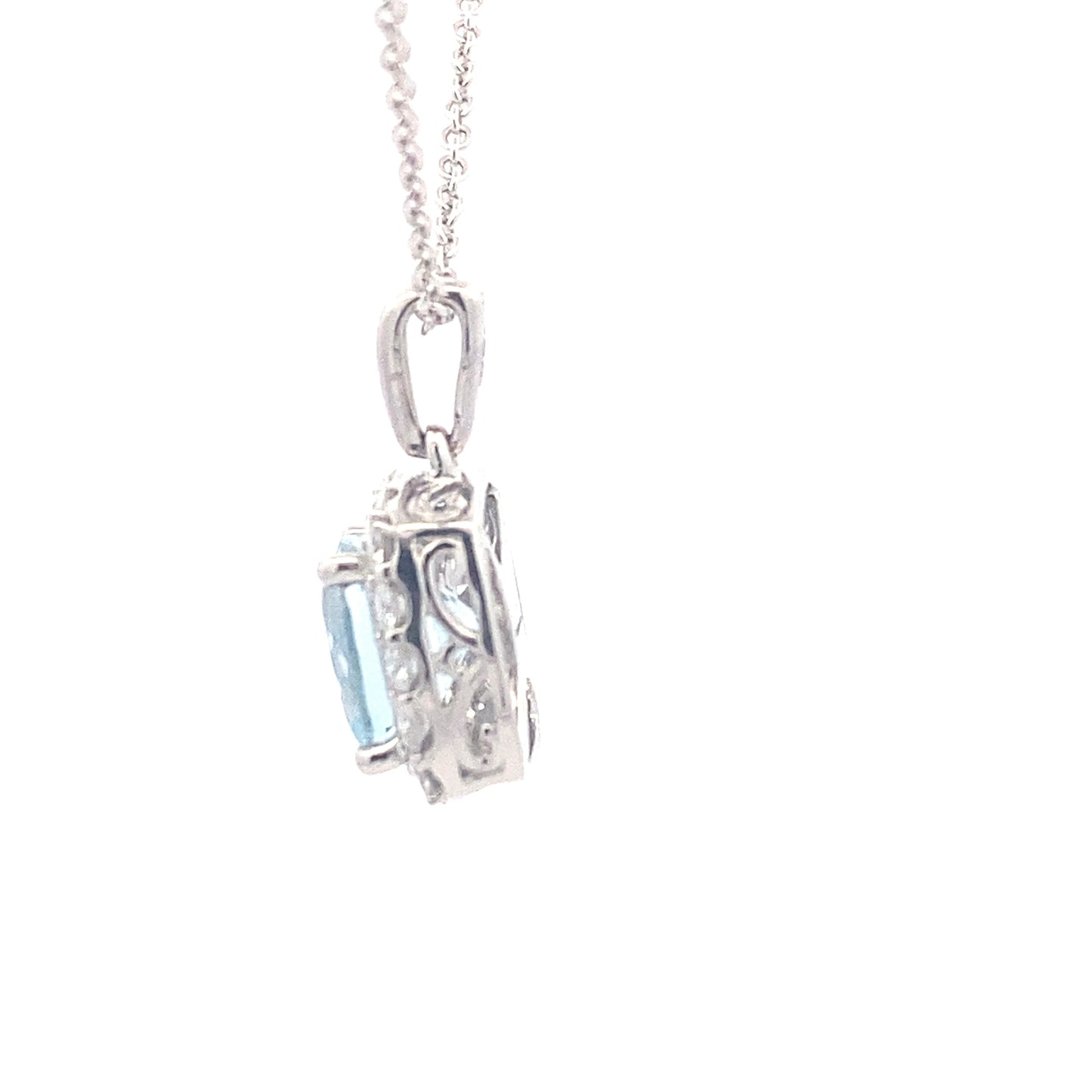 Cushion shaped Aquamarine and round brilliant cut diamond halo pendant Gardiner Brothers