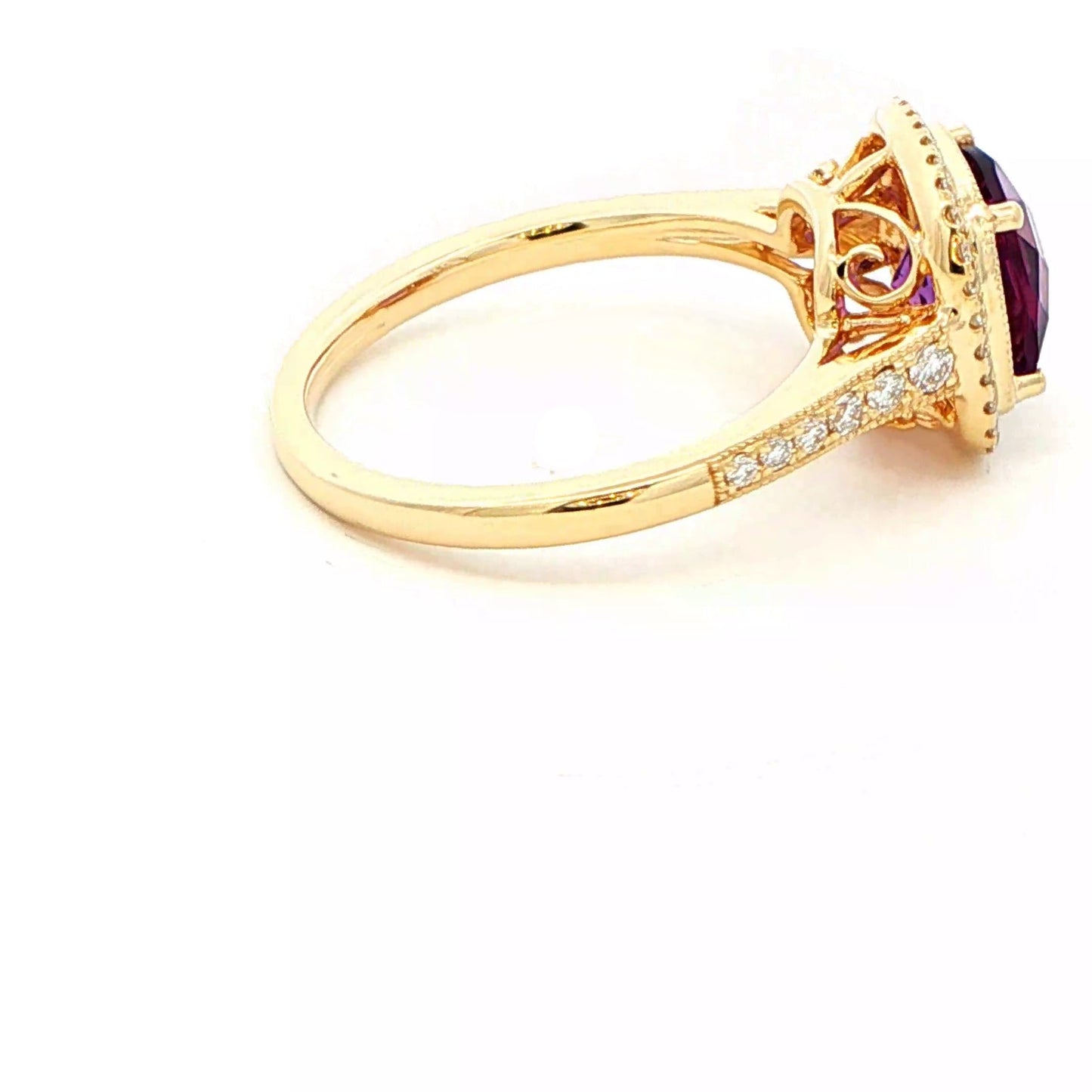 Cushion shaped amethyst and round brilliant cut diamond halo cluster ring Gardiner Brothers