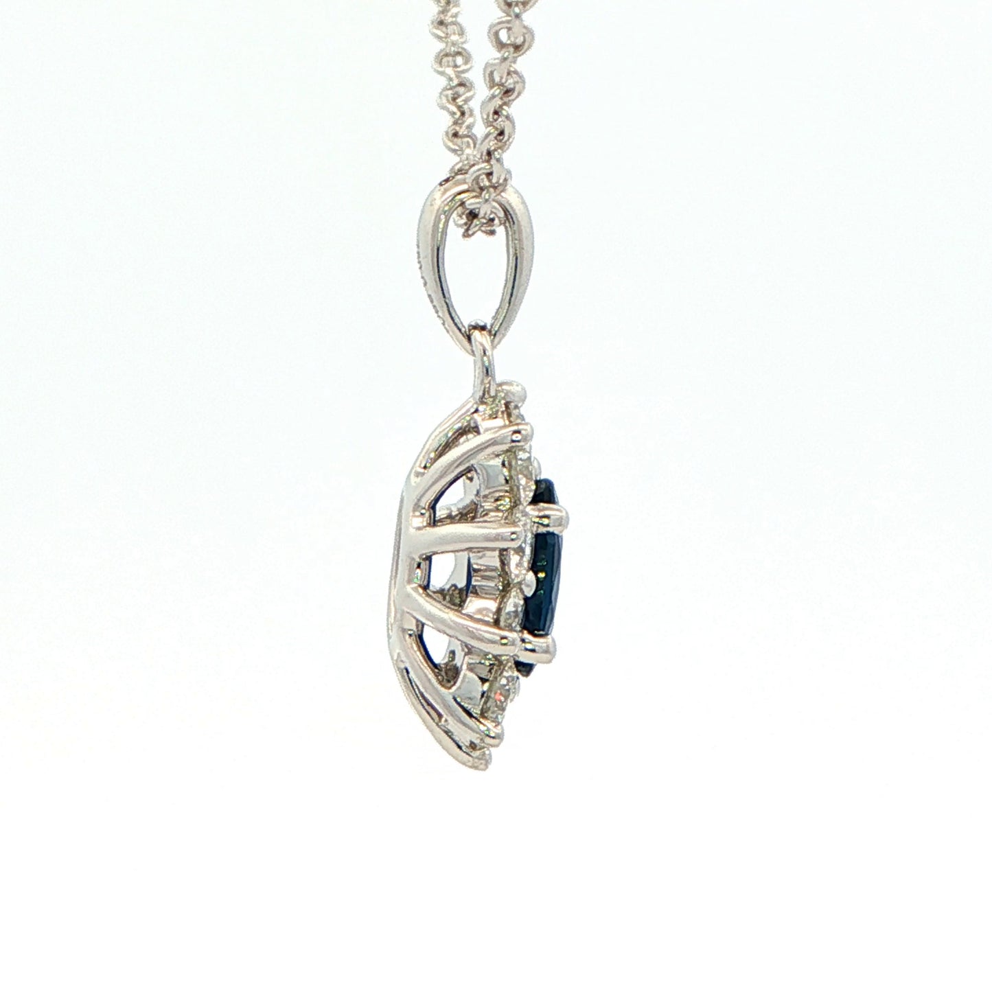 Oval shaped sapphire and round brilliant cut diamond cluster style pendant Gardiner Brothers