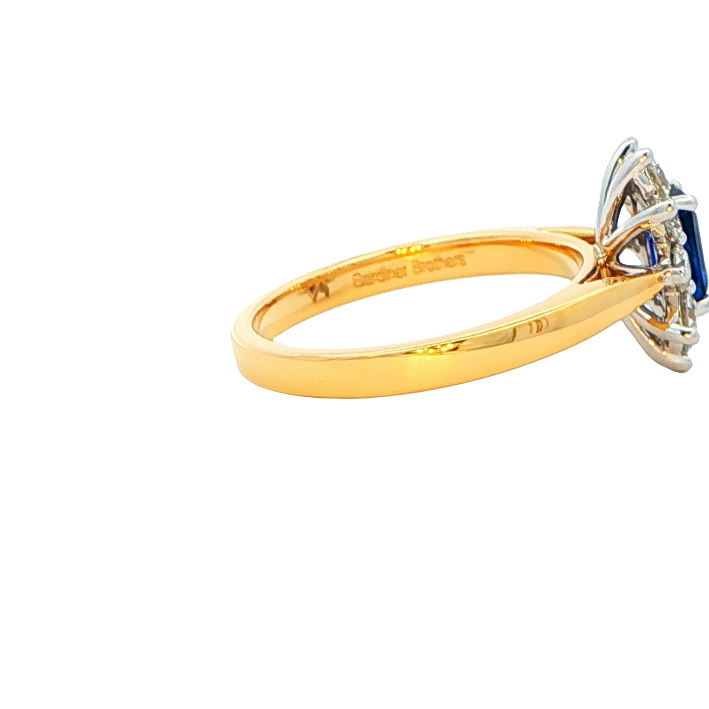 Octagonal Shaped Sapphire and round brilliant cut diamond cluster ring Gardiner Brothers