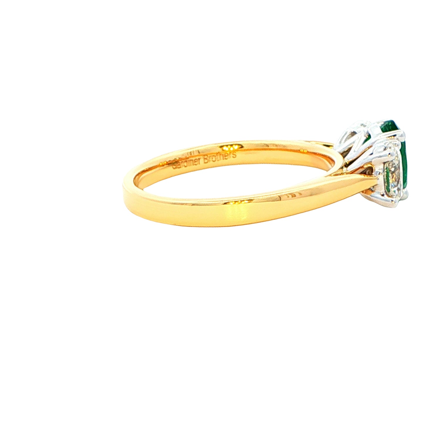 Oval shaped emerald and oval diamond 3 stone ring Gardiner Brothers