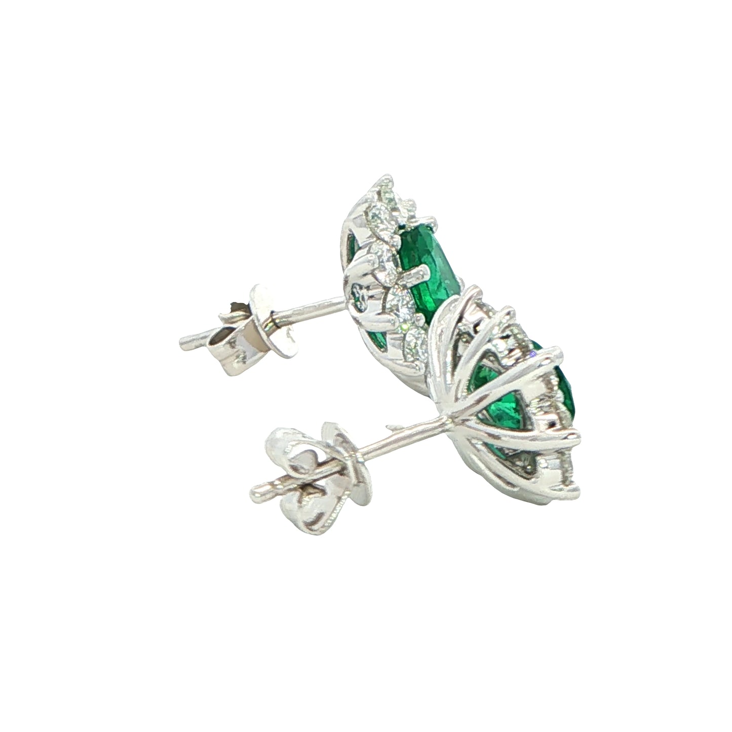 Oval shaped emerald and round brilliant cut diamond cluster style earrings