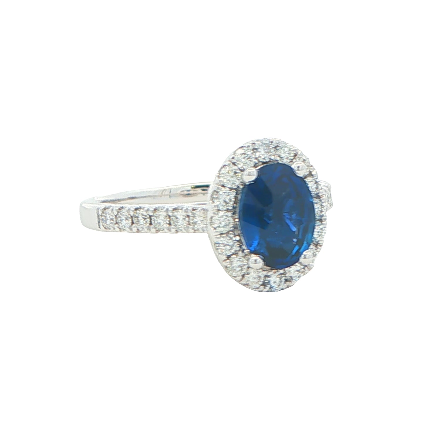 Oval Shaped Sapphire and Round Brilliant Cut Diamond Halo Ring Gardiner Brothers