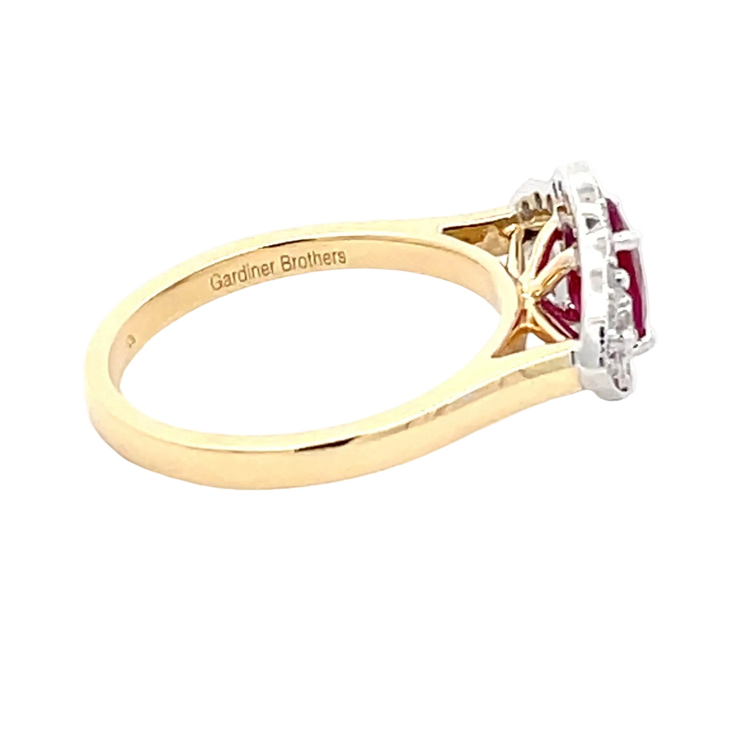 Ruby and diamond vintage halo cluster style ring Gardiner Brothers