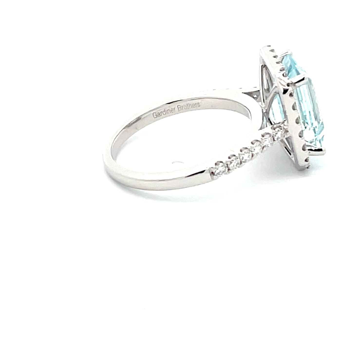 AQUAMARINE AND DIAMOND HALO STYLE RING Gardiner Brothers