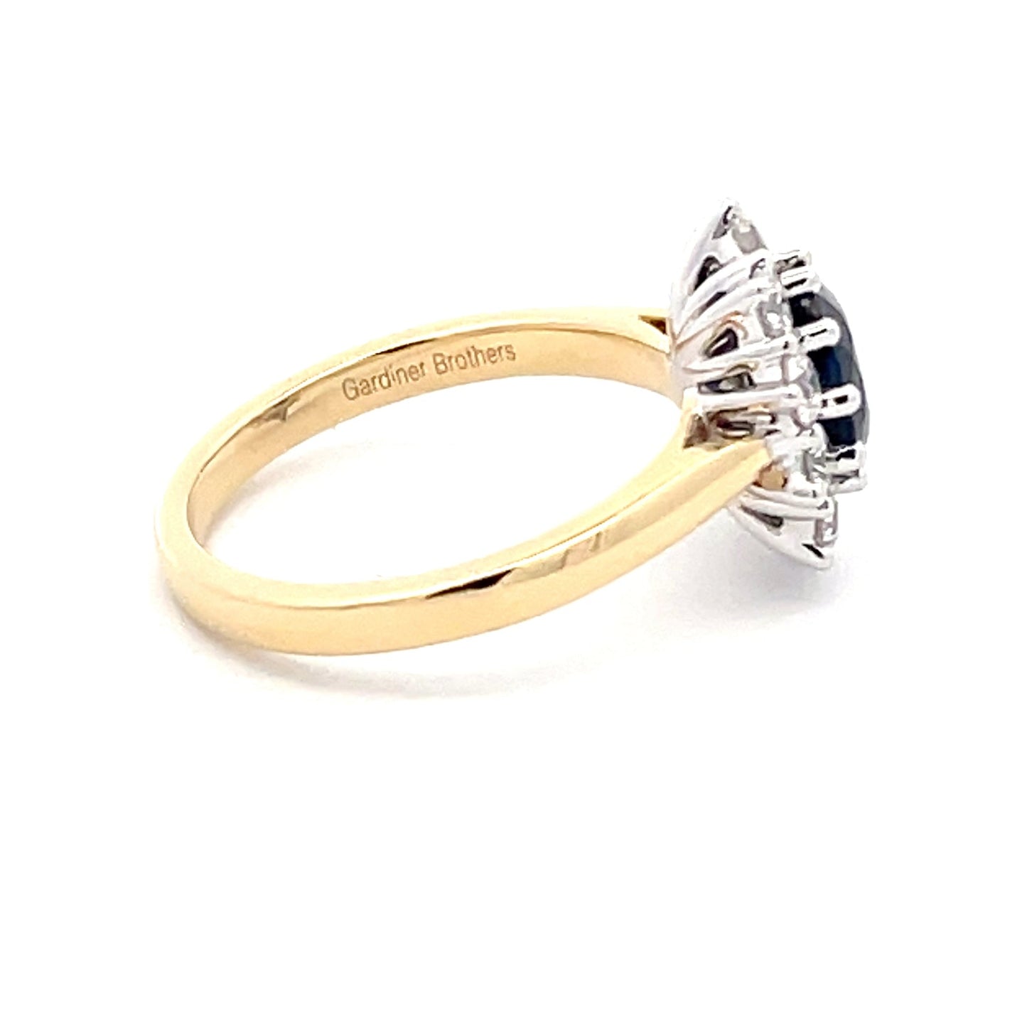 SAPPHIRE AND ROUND BRILLIANT CUT DIAMOND CLUSTER STYLE RING Gardiner Brothers