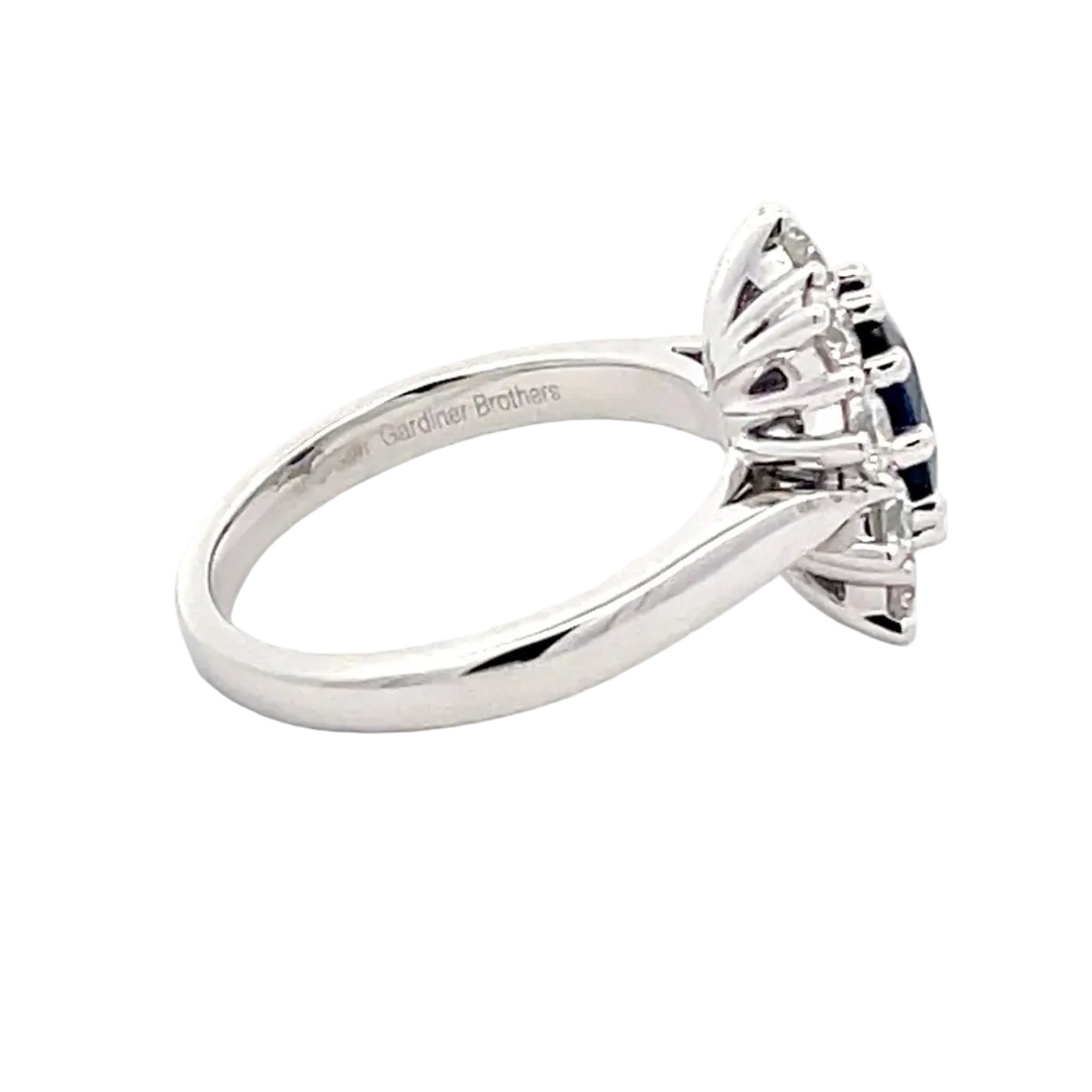 SAPPHIRE AND ROUND BRILLIANT CUT DIAMOND CLUSTER STYLE RING Gardiner Brothers