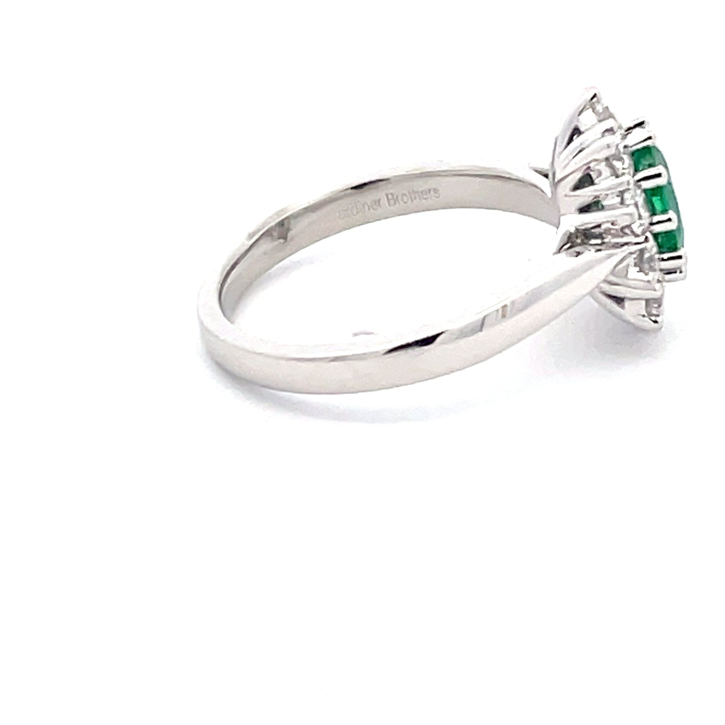 Emerald and round brilliant cut diamond cluster style ring Gardiner Brothers