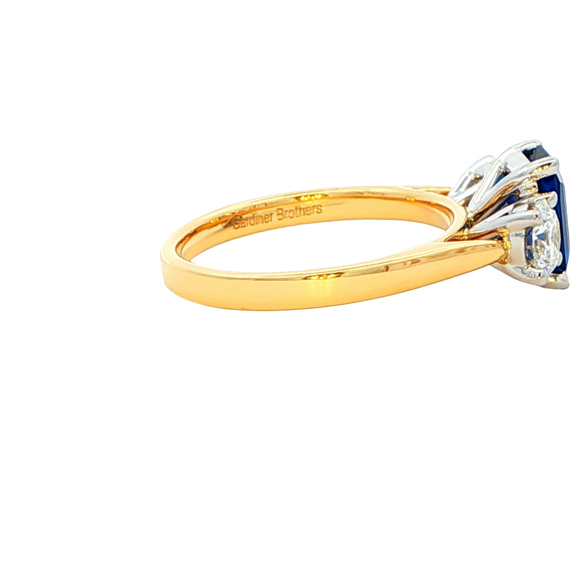 Octagonal Sapphire and Round Brilliant Cut Diamond 3 Stone Ring Gardiner Brothers