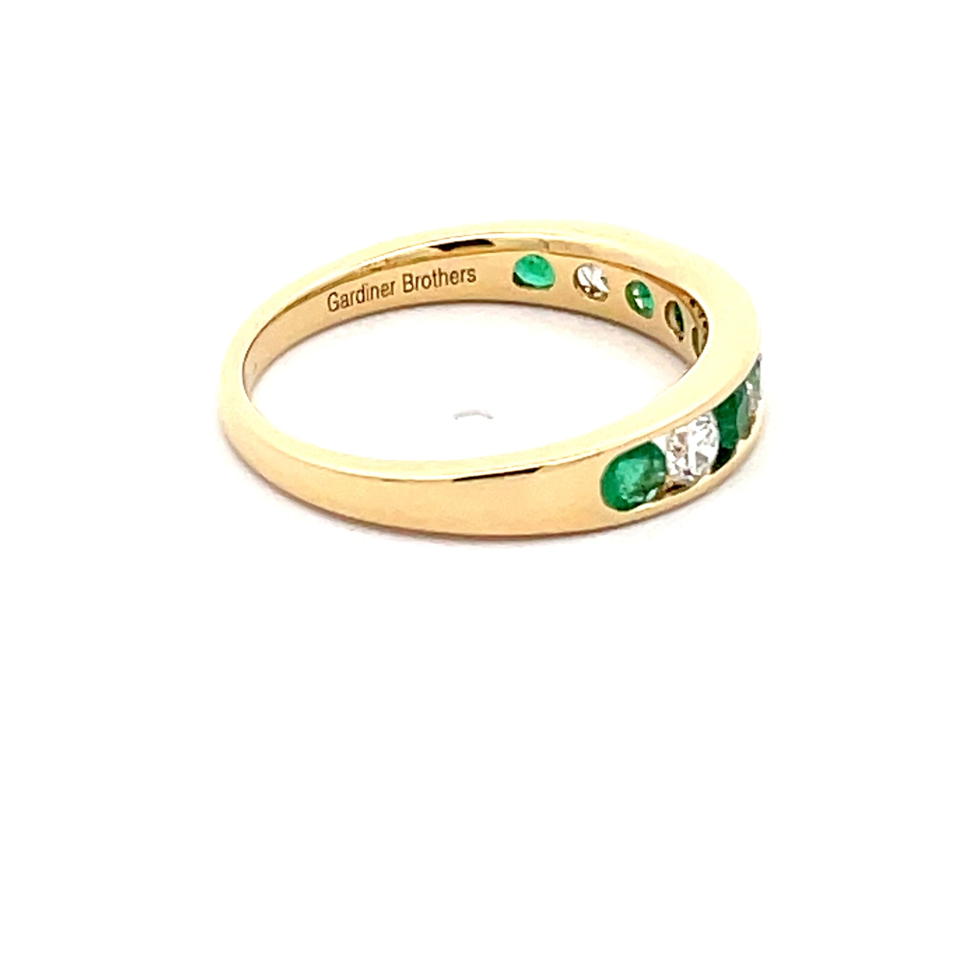Emerald and Round Brilliant cut diamond 9 stone eternity ring  Gardiner Brothers   
