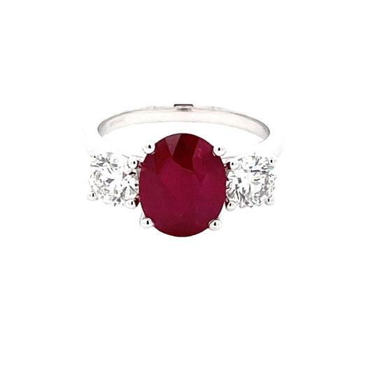 Oval Shaped Ruby and round brilliant cut diamond 3 stone ring