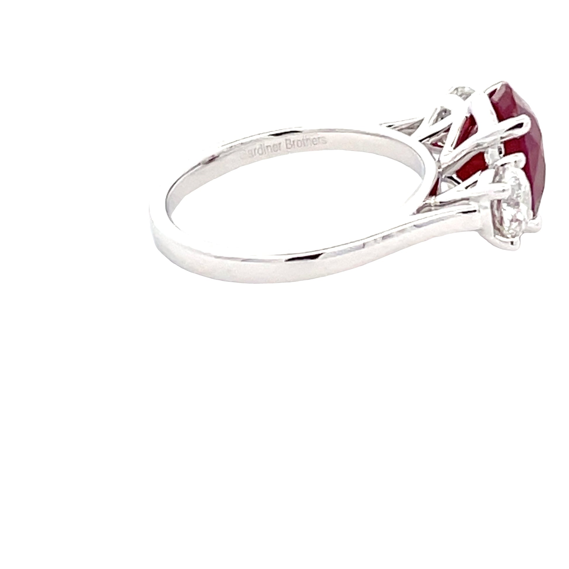Oval Shaped Ruby and round brilliant cut diamond 3 stone ring  Gardiner Brothers   