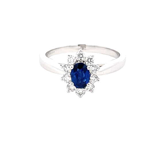 Oval Sapphire and round brilliant cut diamond cluster style ring