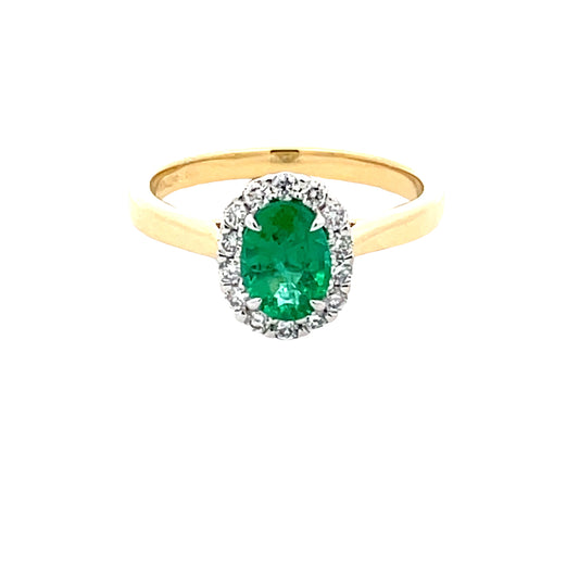 Oval Shaped Emerald and round brilliant cut diamond halo cluster ring