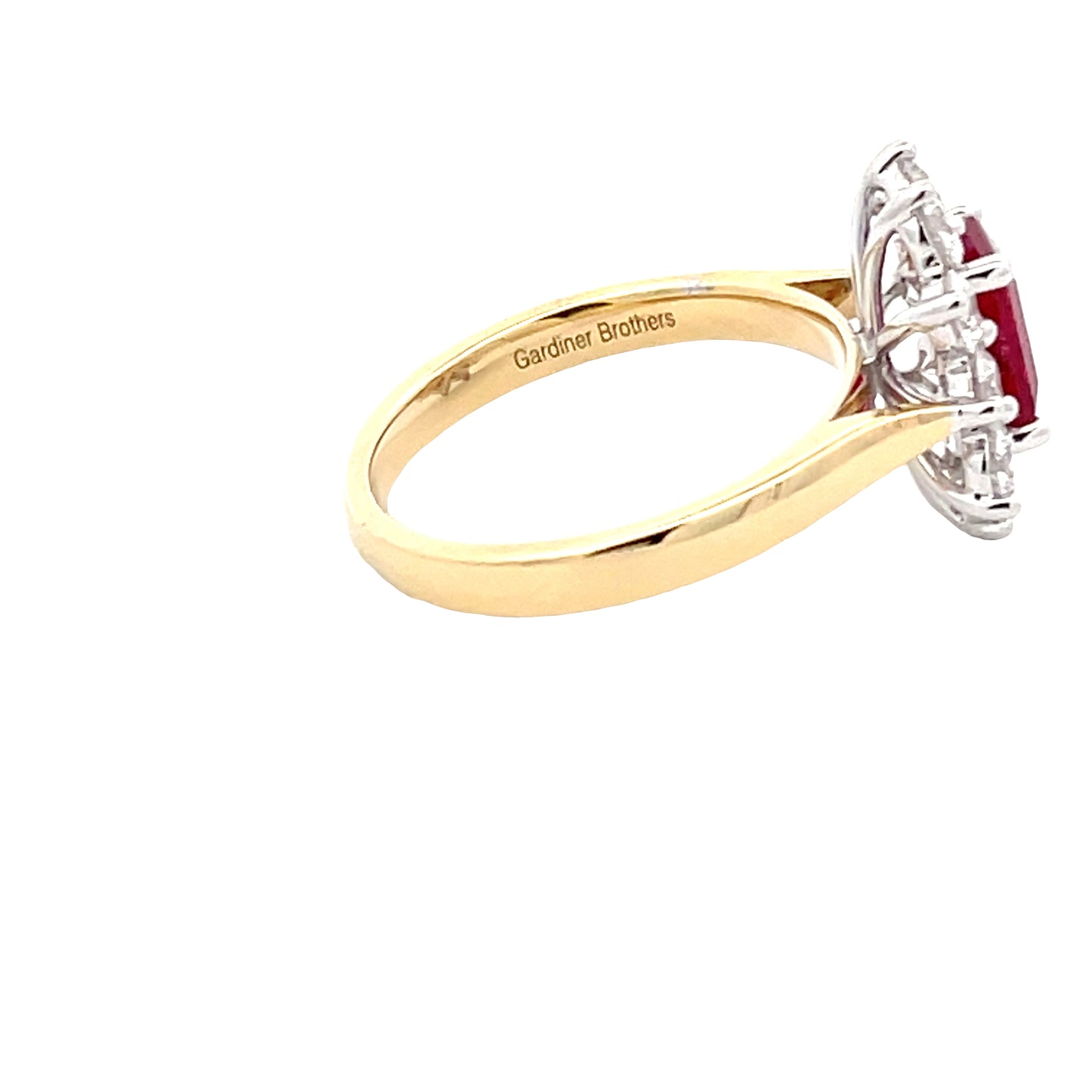 Octagonal shaped ruby and round brilliant cut diamond cluster style ring  Gardiner Brothers   