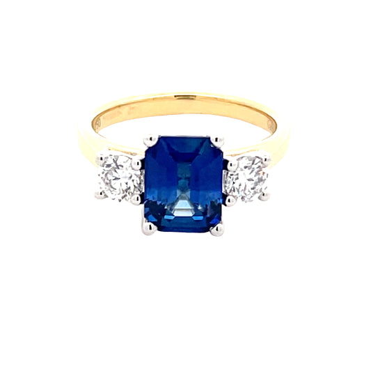 Octagonal Shaped Sapphire and round brilliant cut diamond 3 stone ring