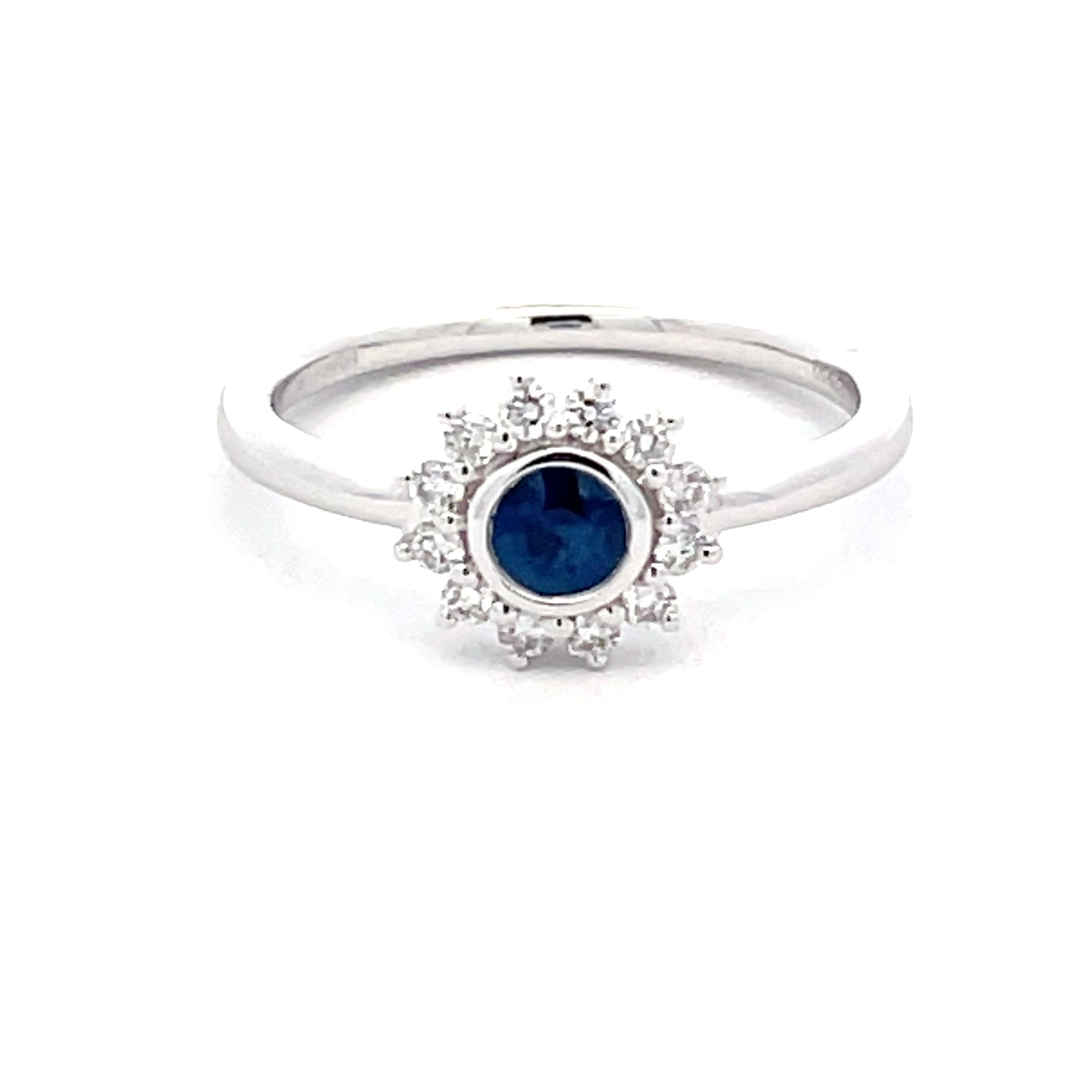 Round Sapphire and round brilliant cut diamond cluster style ring ...