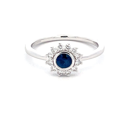 Round Sapphire and round brilliant cut diamond cluster style ring