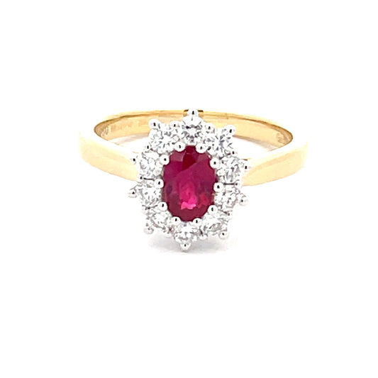 Oval Shaped Ruby and round brilliant cut diamond cluster style ring
