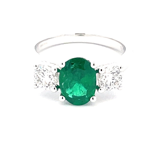 Oval Emerald and round brilliant cut diamond 3 stone ring  Gardiner Brothers   