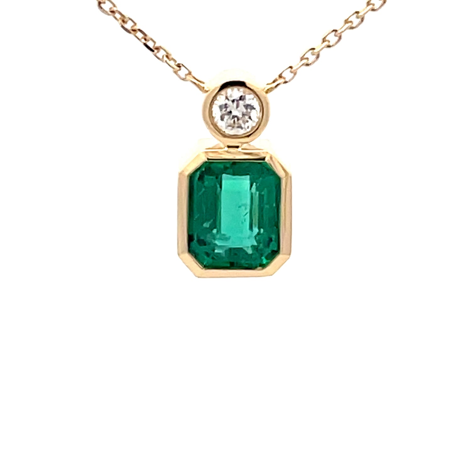 Square Step-cut Emerald and round brilliant cut diamond pendant  Gardiner Brothers   