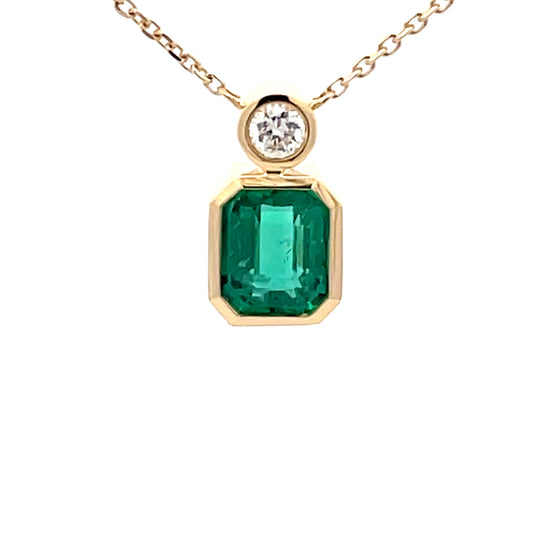 Square Step-cut Emerald and round brilliant cut diamond pendant