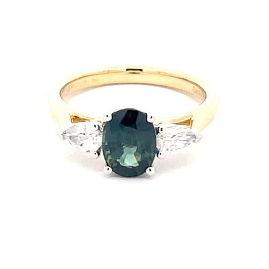 Oval shaped teal sapphire and pear shaped diamond 3 stone ring