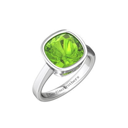 Nova cushion shaped Peridot ring set in a plain bezel setting Gardiner Brothers White Gold