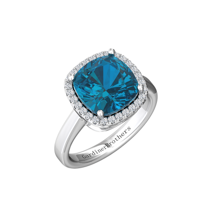 Nova cushion shaped London Blue Topaz ring with a halo of diamonds Gardiner Brothers White Gold