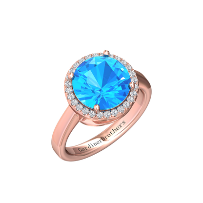 Nova round Swiss Blue Topaz ring with a halo of diamonds Gardiner Brothers Rose Gold
