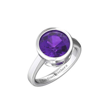 Nova round Amethyst ring set in a plain bezel setting Gardiner Brothers White Gold