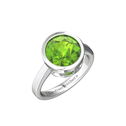 Nova round Peridot ring set in a plain bezel setting Gardiner Brothers White Gold