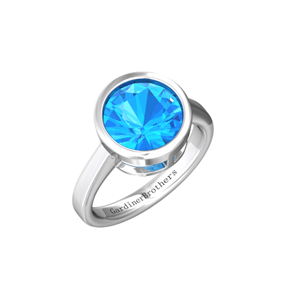 Nova round Swiss Blue Topaz ring set in a plain bezel setting Gardiner Brothers White Gold