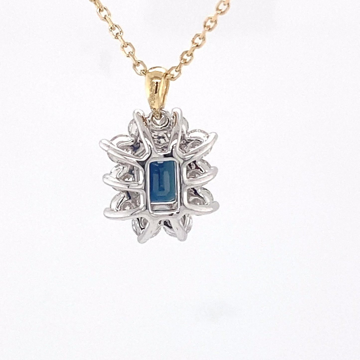 Octagonal sapphire and round brilliant cut diamond cluster pendant  Gardiner Brothers   